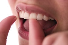 A woman flossing