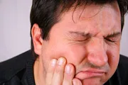 Man in agony with tooth pain