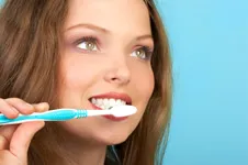 A woman brushing her teeth
