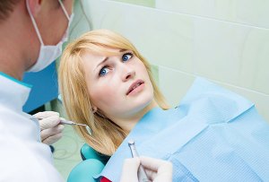 Young woman looking anxious