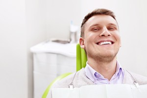 Smiling male dental patient