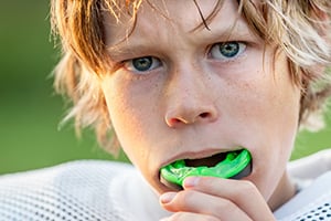 Boy wearing mouthguard